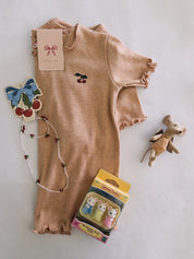 Glitter Konges Slojd Set with cherry design on a light gray background, accompanied by toys.