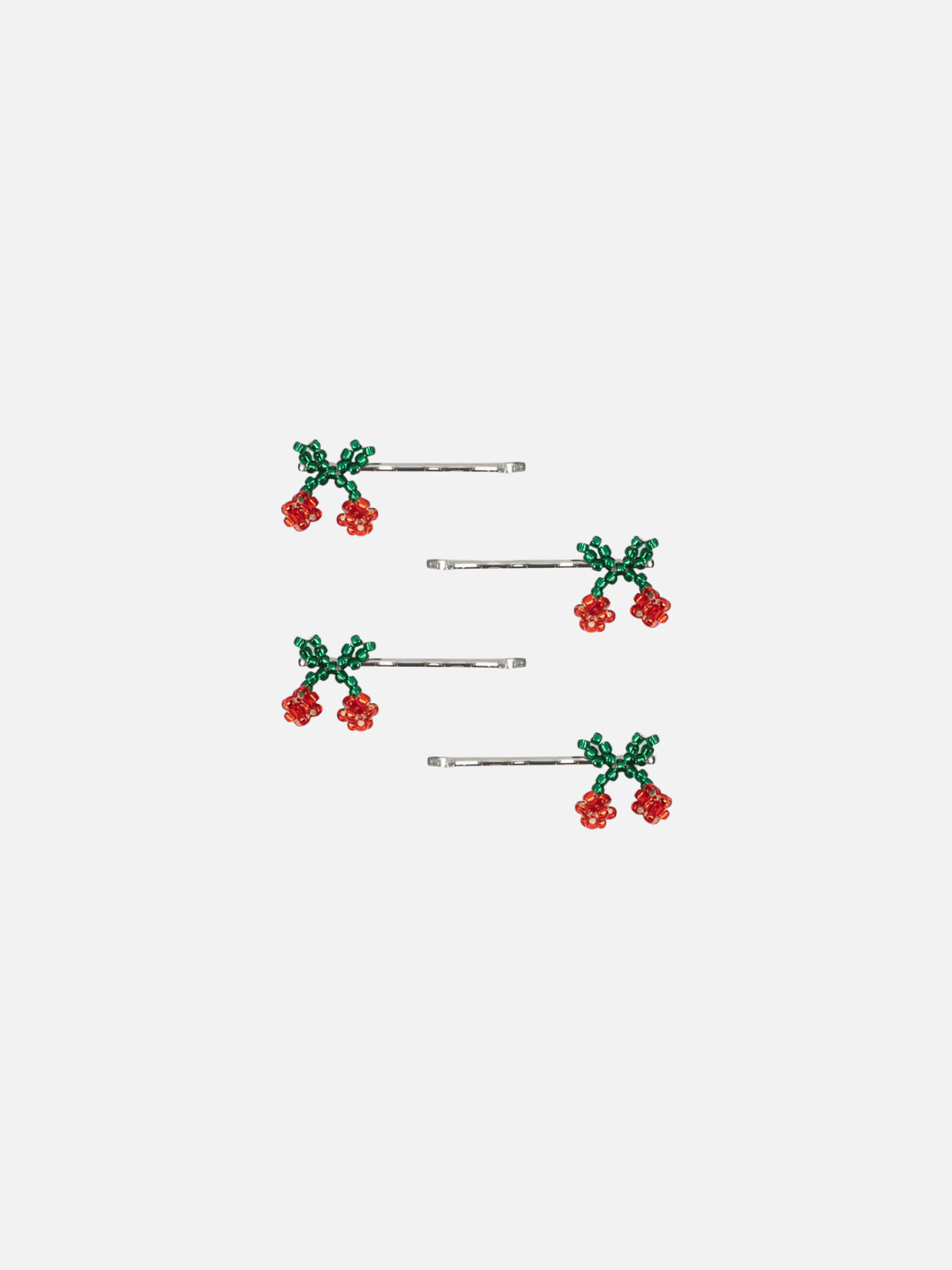 Set of five hair pins with cherry bead designs on a white background