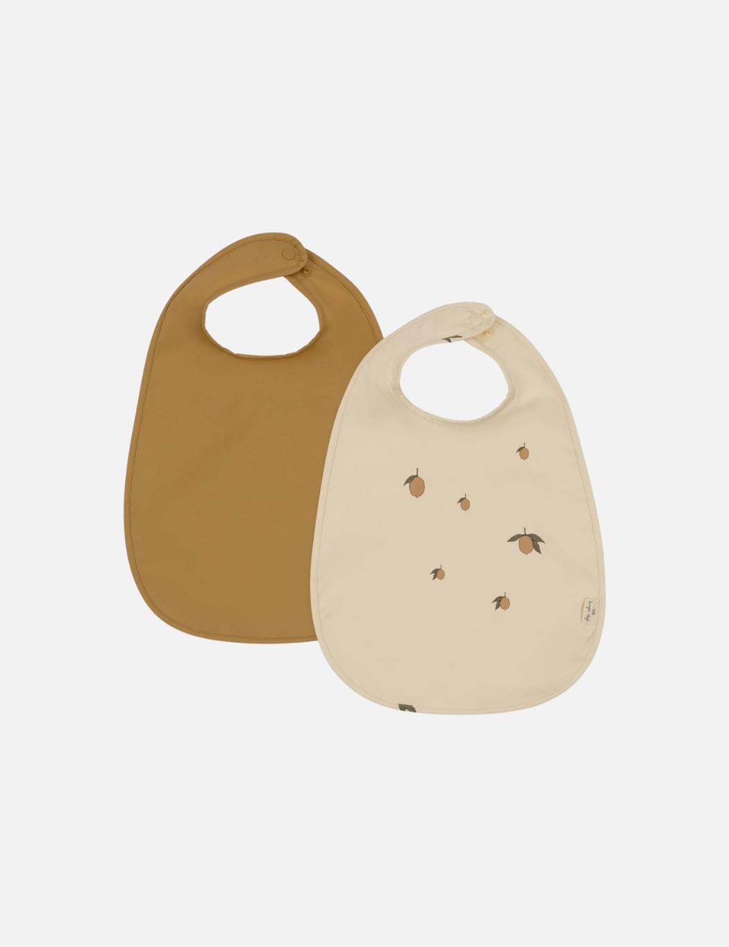 Two baby bibs, one mustard brown and one beige with a subtle lemon pattern.