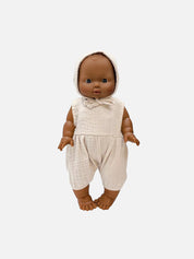 Baby doll wearing a beige outfit on a white background