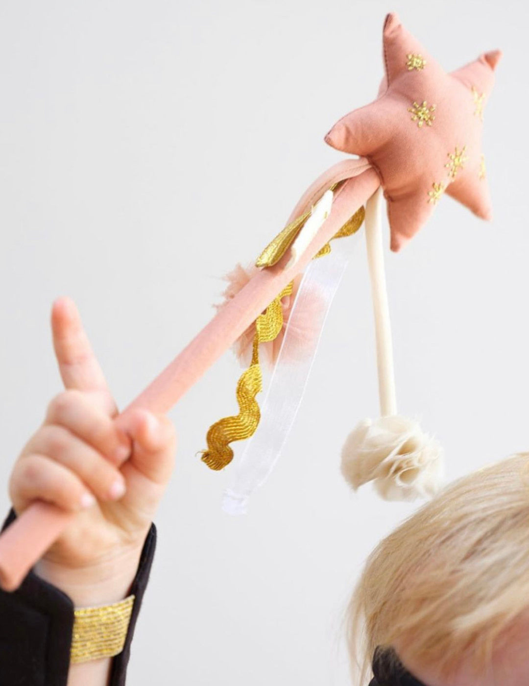 A magic wand toy made out of pink fabric by Fabelab