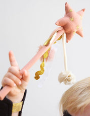 A magic wand toy made out of pink fabric by Fabelab